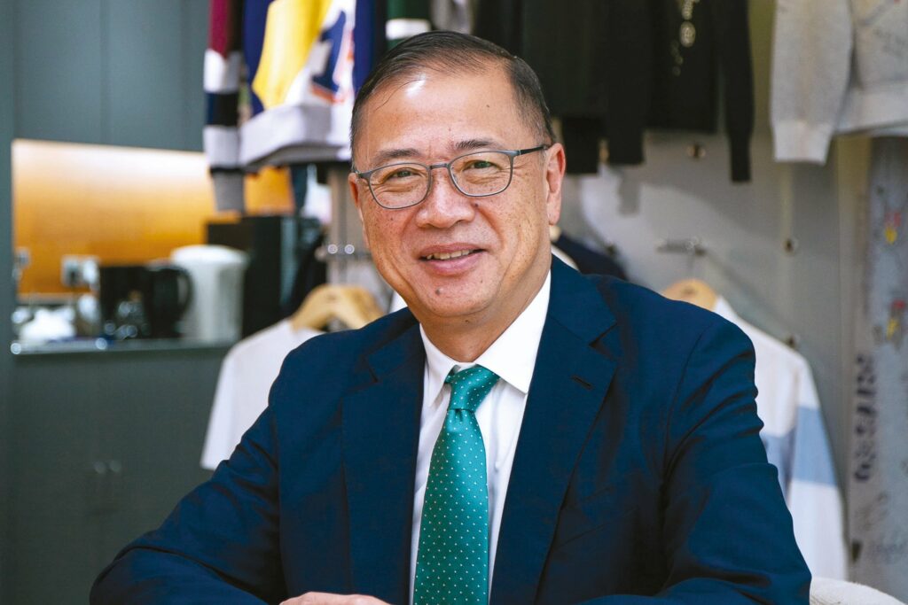 Raymond-Tan sitting in office