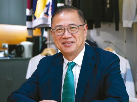 Raymond-Tan sitting in office